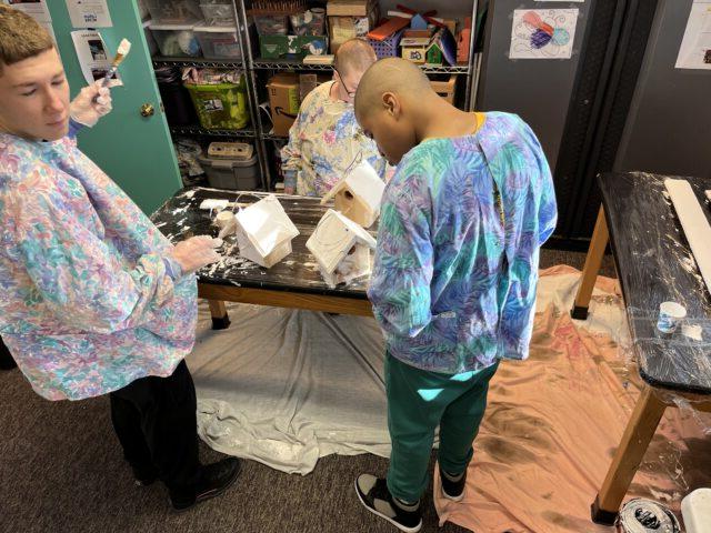 Students work in our Vocational Room making wooden bird houses